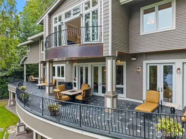 Expansive main-floor balcony with French doors opening from the living room, dining room, kitchen, & family room. Also ideal for hosting large social gatherings. Expansive main-floor balcony with French doors opening from the living room, dining room, kitchen, & family room. Also ideal for hosting large social gatherings.