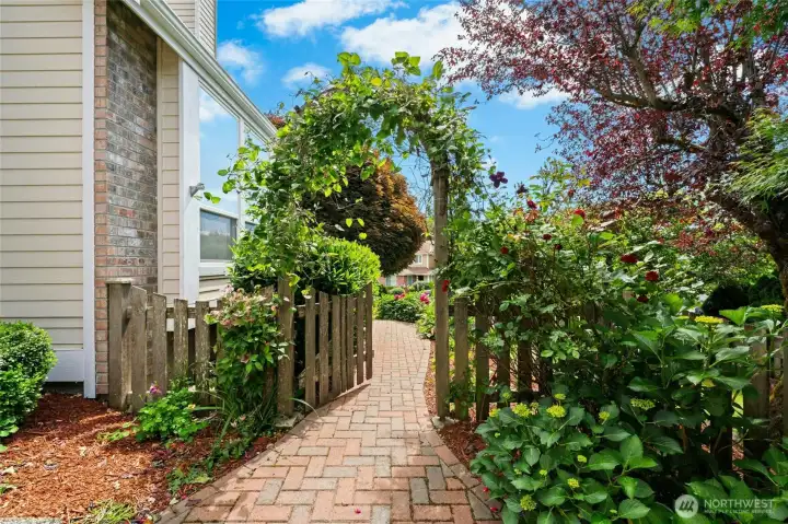 Who doesn't just love a rose covered arbor? The garden and yard that come with this home are incredible.