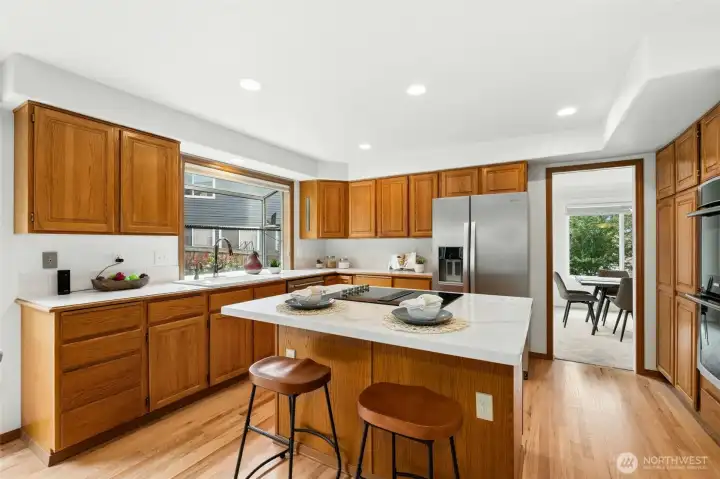 Very functional kitchen with quartz counters and oak hardwood floors. The beautiful floors were just refinished and are such an upgrade to the LVP we see so much of.