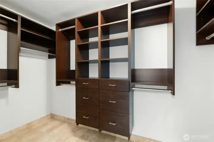 The primary walk in closet is much larger than this photo shows. It's very spacious and has a great closet  storage system.