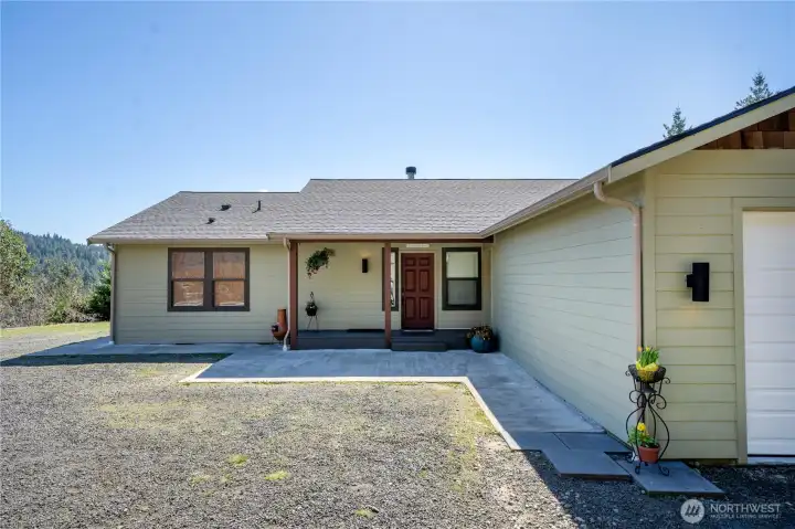 Crisp, well-maintained curb appeal with an easy approach, generous parking, and an attached two-car garage—welcome home to your private hilltop retreat.