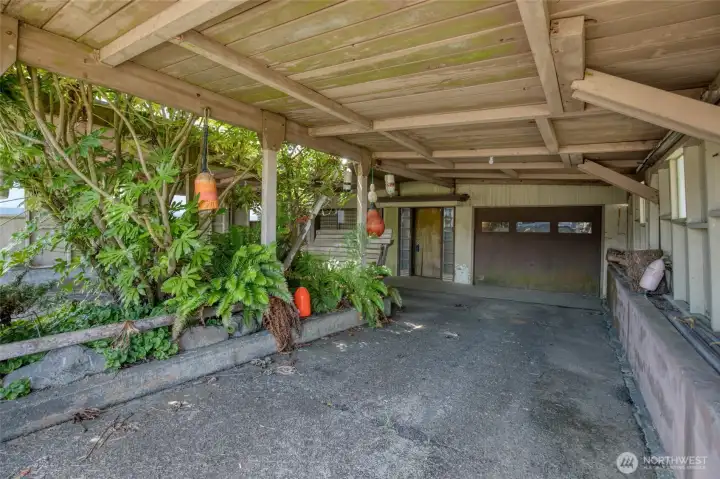 There is room for two cars under the carport and there is a single car garage. There is room for two cars under the carport and there is a single car garage.