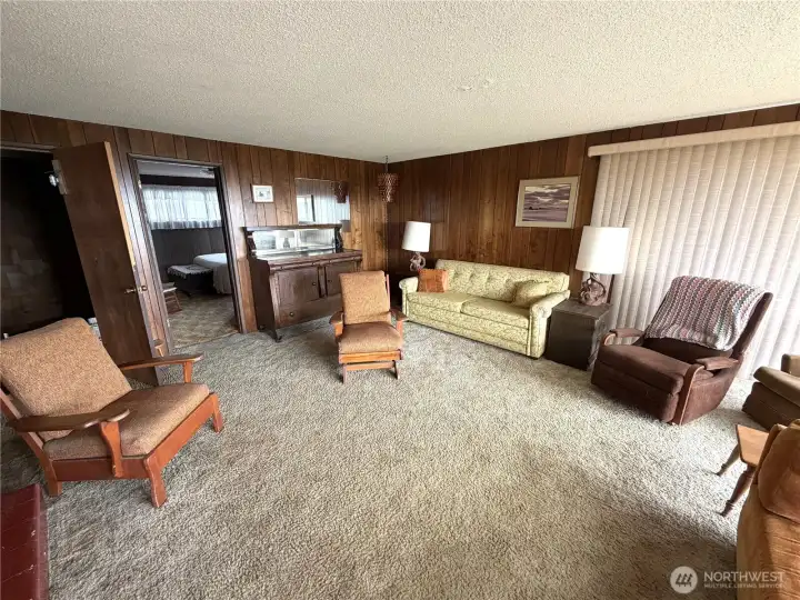 Inside the main level offers a living space with wood burning fireplace and two bedrooms. Inside the main level offers a living space with wood burning fireplace and two bedrooms.