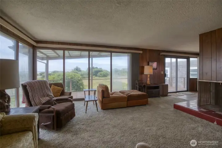 Inside the main level offers a living space with wood burning fireplace and two bedrooms. Inside the main level offers a living space with wood burning fireplace and two bedrooms.
