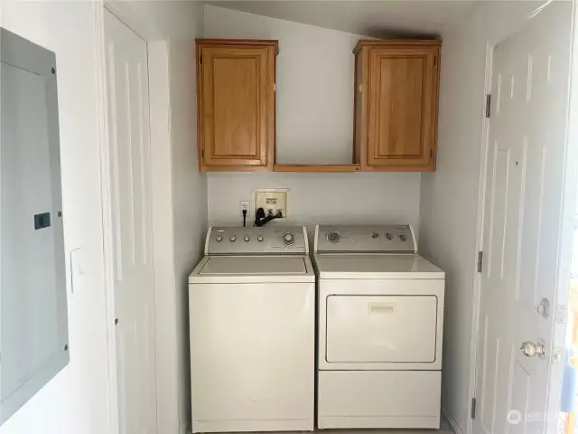 Laundry room, with entrance to guest bathroom.