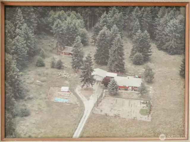 Old photos before and after the barn was built.
