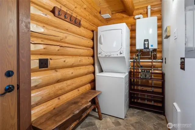 Downstairs utility room and on demand hot water tank.