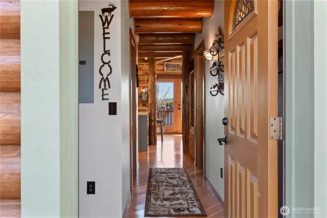 Upon entering the house, you will find the hallway where the downstairs bedroom and bathroom are located of off.  At the end of this hallway.....paradise!
