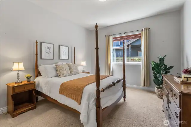 Large windows fill this bedroom with an abundance of natural light
