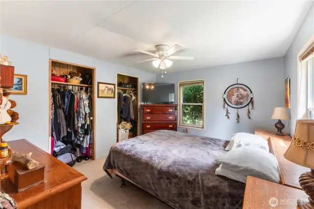 Spacious primary bedroom with ample closet space and 3/4 bathroom.