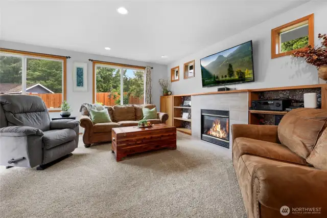 The home has a large, great room at the back of the house with French doors to block off from other parts of home on game days. The room offers large picture windows that allow plenty of natural light. The room also has a gas fireplace, built-in shelves, and a half bathroom.