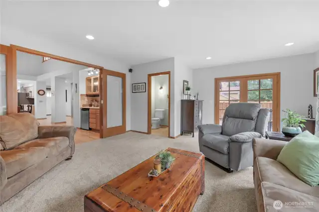 The home has a large, great room at the back of the house with French doors to block off from other parts of home on game days. The room offers large picture windows that allow plenty of natural light. The room also has a gas fireplace, built-in shelves, and a half bathroom.