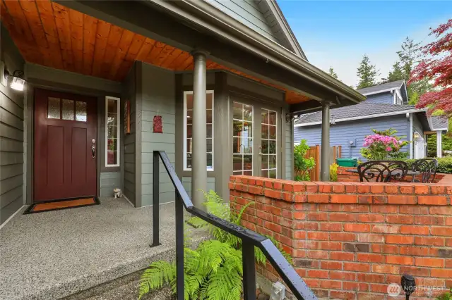 Front door and porch area.  Main entry door to left and to the right are French doors that lead out for the perfect morning coffee spot.