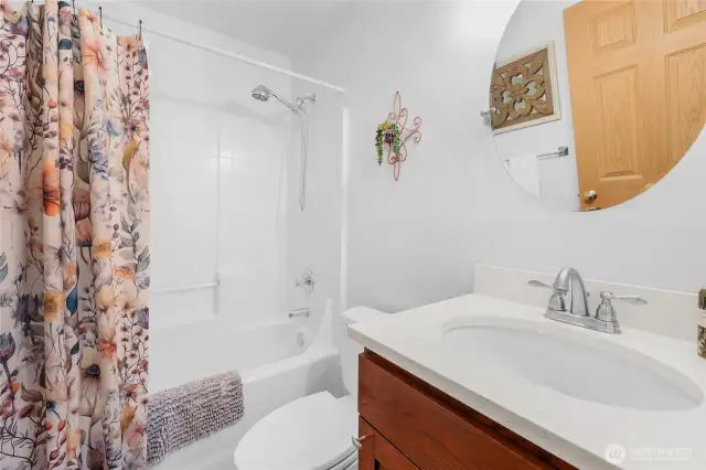 The full main floor bathroom that is located near the bedrooms.