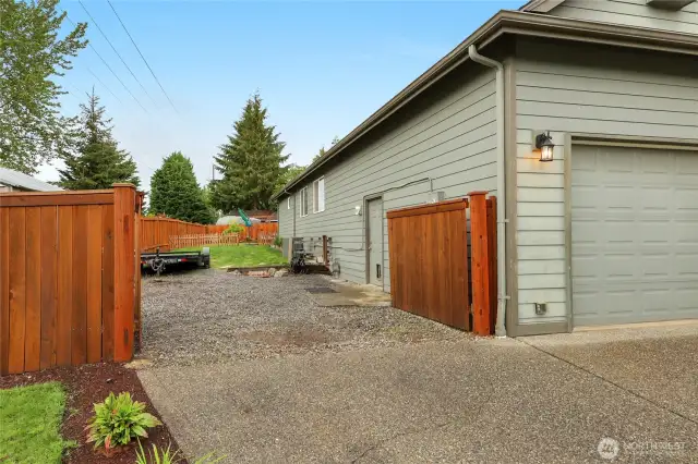The fully fenced yard has large gates that can accommodate RV, boat, or trailer parking on the side of the home. This is a rare bonus feature for homes in the area.