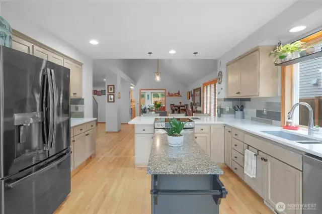 This kitchen's spacious design allows plenty of room for food preparation, plus there's no lack of storage. The large countertop makes this an excellent location for doing so. The ample natural light makes the area bright.  Hardwood floors lead out to large dining room area and all appliances included!