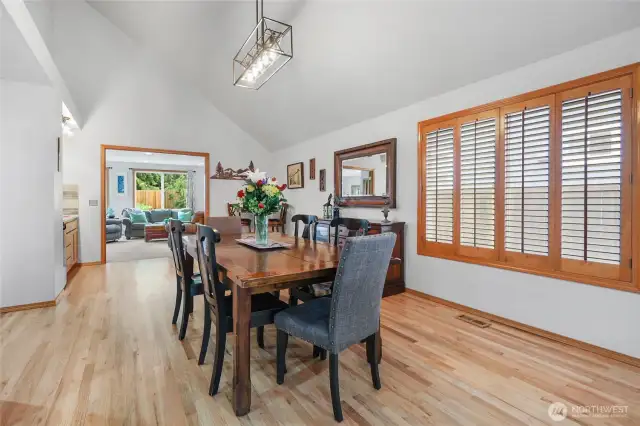 Large dining area just off kitchen includes vaulted ceilings and hardwood floors. Also leads to wine nook area with wet bar and beverage cooler.