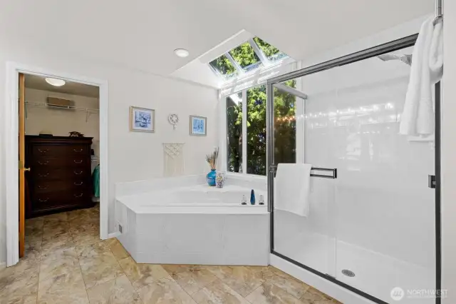 Sunroom style window over soaking tub. Large walk in closet.
