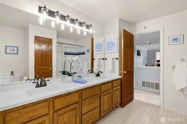 Main full bath on upper level. Dual sink vanity, quartz counter tops, new faucets and light fixture.