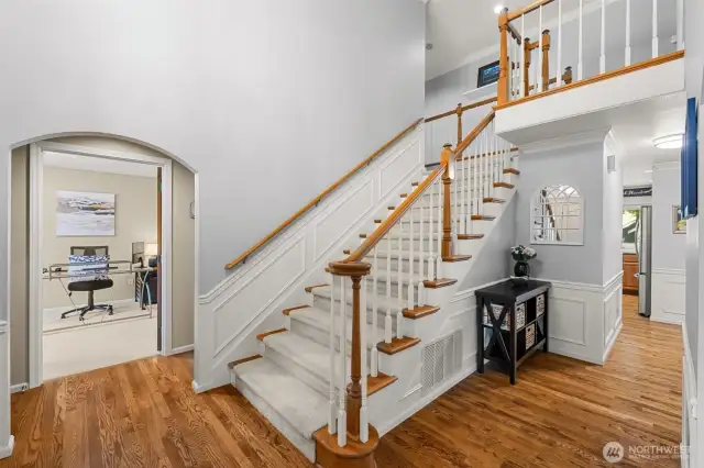 Open foyer clear story with hardwood floors.