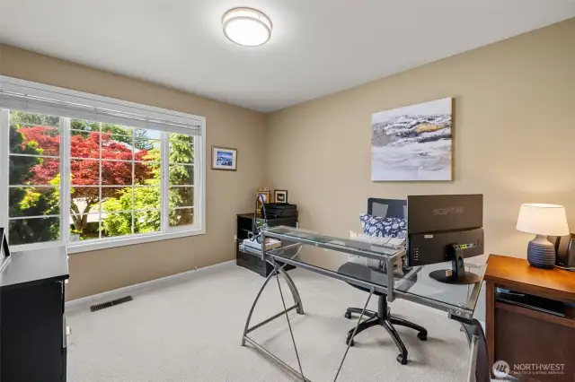 Main floor bedroom or office with adjacent half bath.