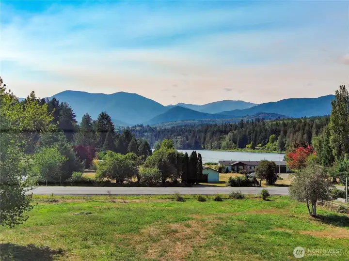Views of the lake and Olympic Foothills from the site. Located just a short walk to the public fishing dock & boat launch for year round fishing & more !