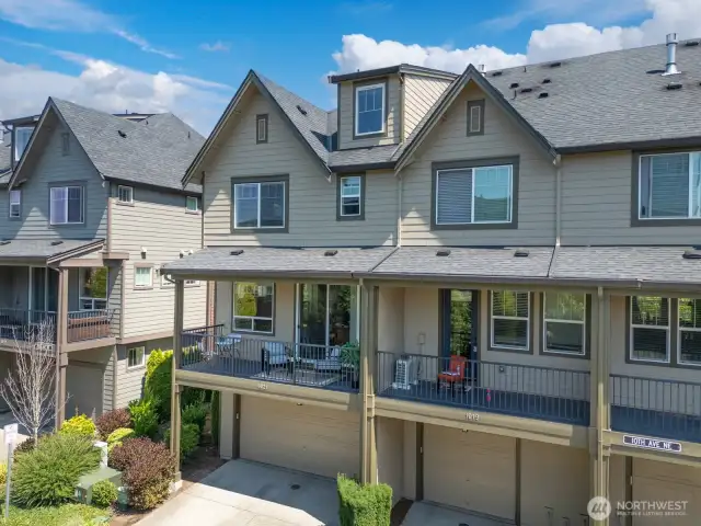 End unit, 2 car garage with extra parking in front.