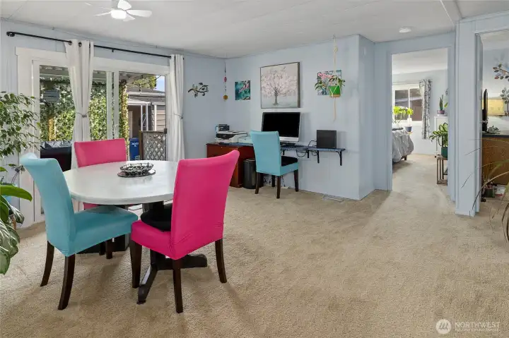 Family room features built-in office area with custom desk, new paint, new flooring and new door. Back porch area through slider.