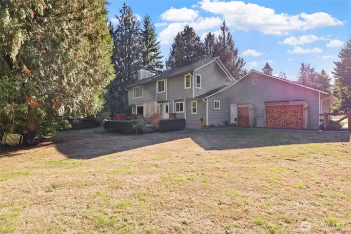 Fully fenced rear yard-cordwood stays