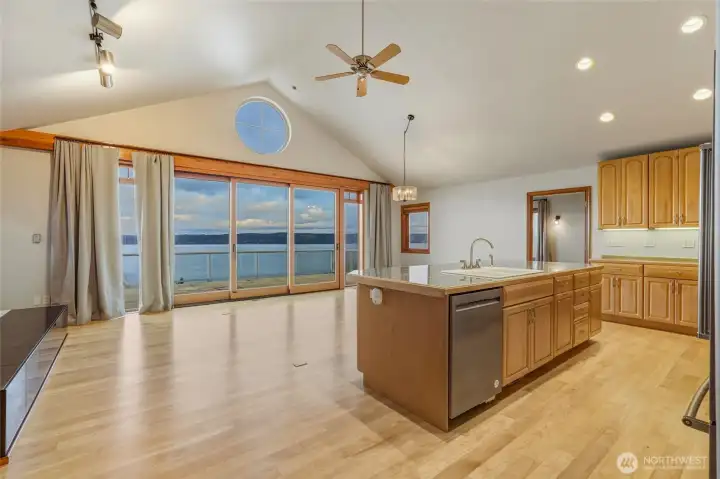 Immediately greeted w/ soaring ceilings & Baltic Birch hardwood floors flowing through an open, light-filled main floor- Views from nearly every room.