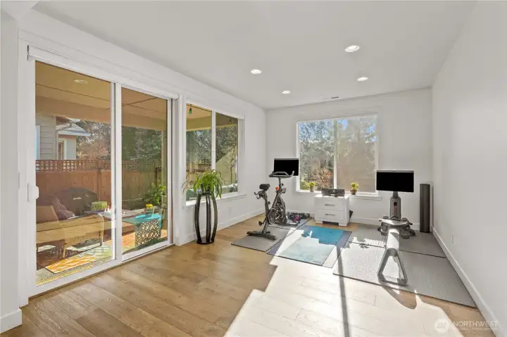 Dining room is filled with light and enjoys indoor/outdoor flexibility!  Currently used as an exercise studio