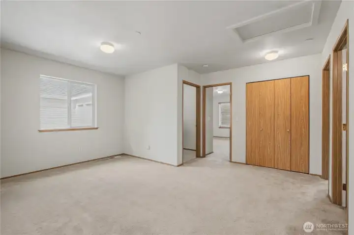 Upstairs, an open bonus area can be converted to a 5th bedroom with its own walk-in closet.