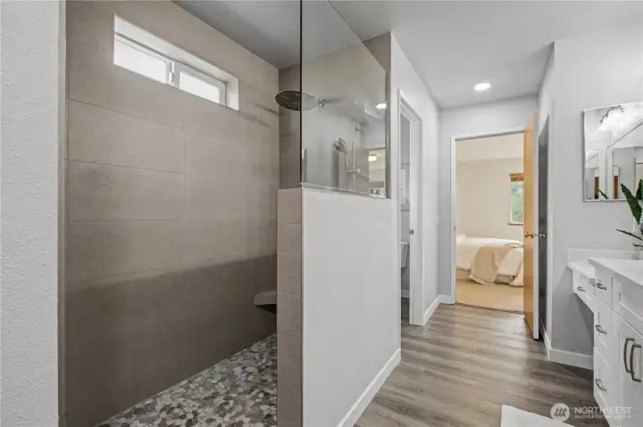 Luxury primary bathroom with walk-in shower.