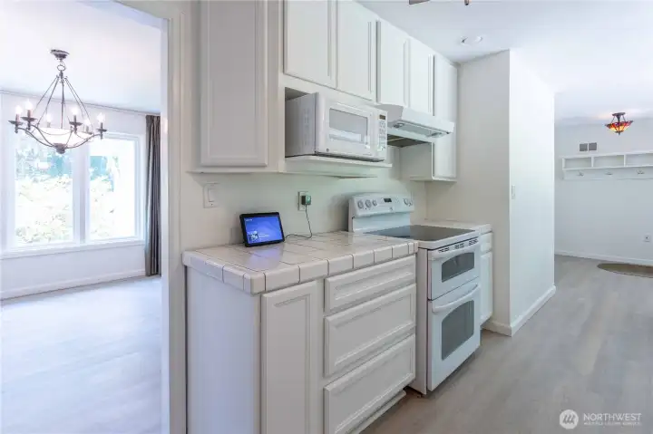 White cabinets expand this kitchens appeal