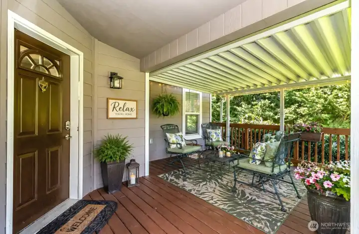 Covered entry large enough to include a sitting area.