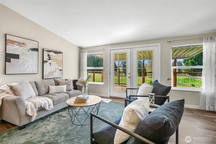 Great room opens to large, partially covered deck