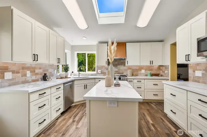 Amazing kitchen finished with Quartz and tile, stainless appliances and a copper hood.