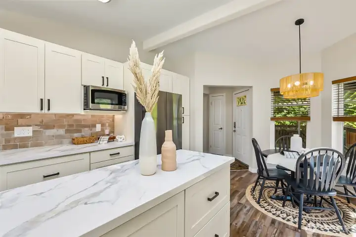 This view of the kitchen shows the breakfast nook