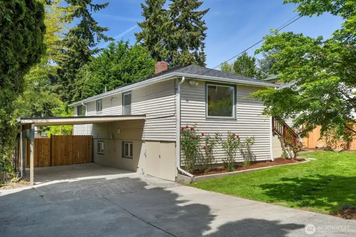 Long driveway and covered parking provide convenience, off-street parking, and additional storage flexibility. Long driveway and covered parking provide convenience, off-street parking, and additional storage flexibility.
