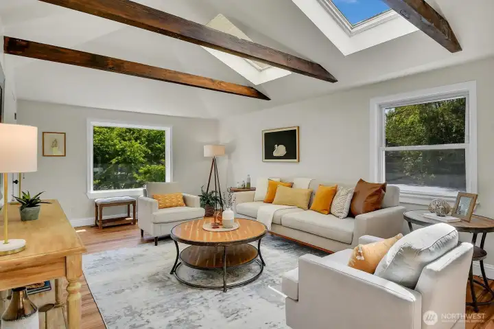 Stunning main living room with vaulted ceilings, skylights, exposed beams, and classic Pacific Northwest charm. Stunning main living room with vaulted ceilings, skylights, exposed beams, and classic Pacific Northwest charm.