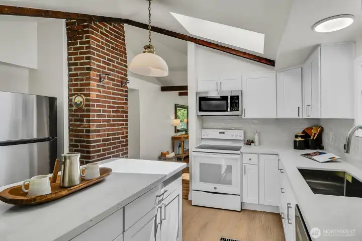 Modern kitchen with expansive counters, abundant cabinetry, and stylish finishes designed for everyday living and entertaining. Modern kitchen with expansive counters, abundant cabinetry, and stylish finishes designed for everyday living and entertaining.
