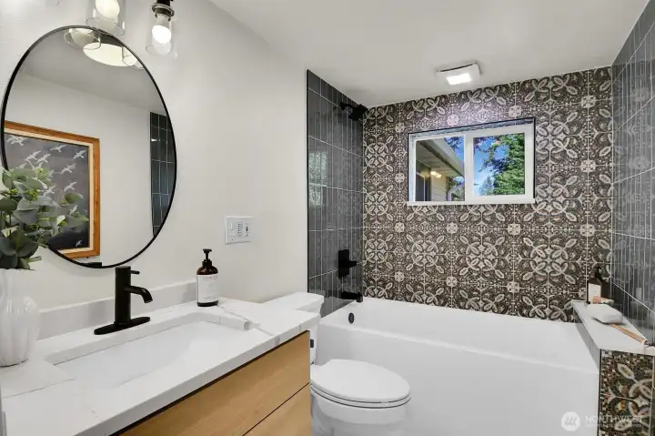 Recently remodeled full bathroom Recently remodeled bathroom with stylish tile surround, updated vanity, and modern contemporary design. Recently remodeled full bathroom Recently remodeled bathroom with stylish tile surround, updated vanity, and modern contemporary design.