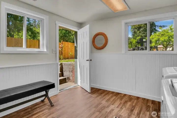 Light-filled flex space with large windows and backyard views—ideal for a mudroom, reading nook, or home office setup. Light-filled flex space with large windows and backyard views—ideal for a mudroom, reading nook, or home office setup.