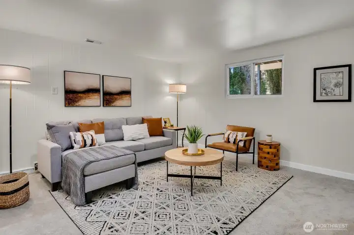 Comfortable bonus living area with oversized windows, modern staging, and natural light throughout this move-in ready Seattle home. Comfortable bonus living area with oversized windows, modern staging, and natural light throughout this move-in ready Seattle home.