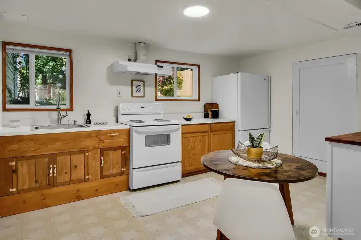 Functional lower-level kitchen with generous prep space and flexible layout ideal for multigenerational living. Functional lower-level kitchen with generous prep space and flexible layout ideal for multigenerational living.