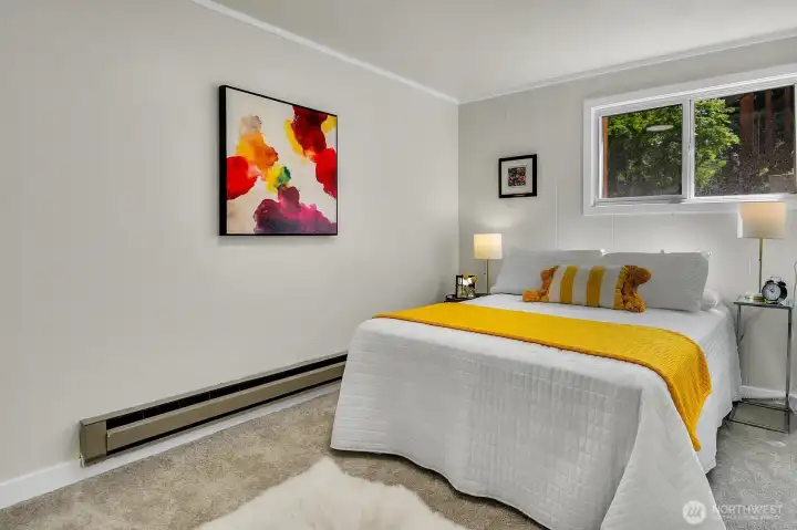 Spacious lower-level bedroom with natural light and private atmosphere perfect for guests or extended living. Spacious lower-level bedroom with natural light and private atmosphere perfect for guests or extended living.