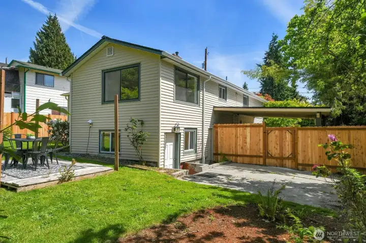 Rear exterior view highlighting spacious lot, updated exterior, and private outdoor living areas in West Seattle. Rear exterior view highlighting spacious lot, updated exterior, and private outdoor living areas in West Seattle.