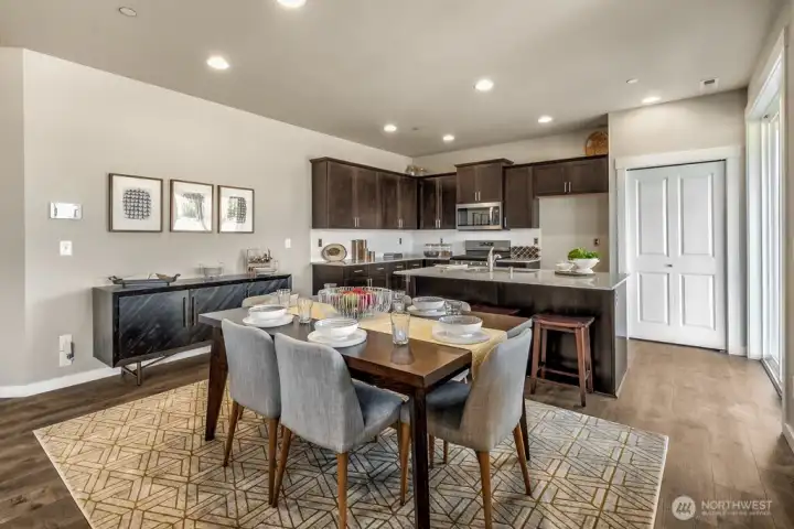 The Wellington has a breakfast bar and dining area. Photos are for representational purposes only. Colors and finishes may vary. The Wellington has a breakfast bar and dining area. Photos are for representational purposes only. Colors and finishes may vary.