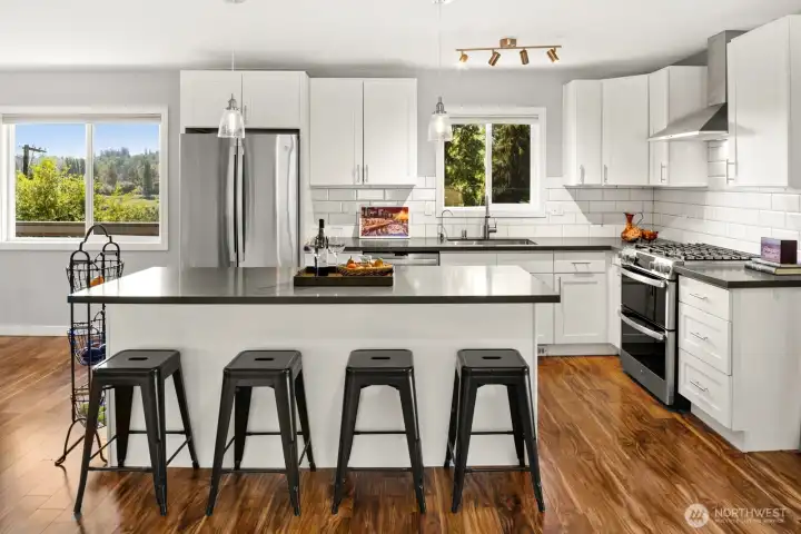 Grab a stool, and a beverage and keep the cook company.  This is a fun kitchen to cook in!