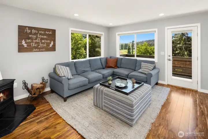 Living Room with wonderful views to "farm country" across the street, and a large glass door leading onto the deck.